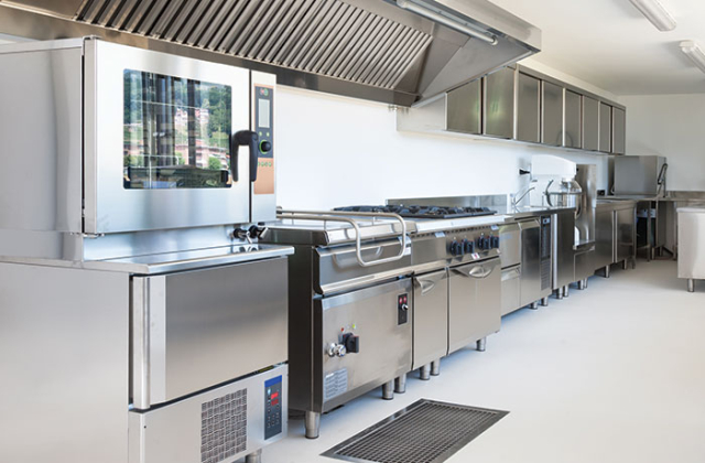 Commercial kitchen with professional appliances serviced by Appliance Medics