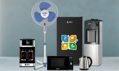 Office kitchen with commercial coffee machine and under-counter fridge