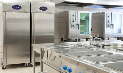 Commercial kitchen in a restaurant with professional ovens and refrigeration